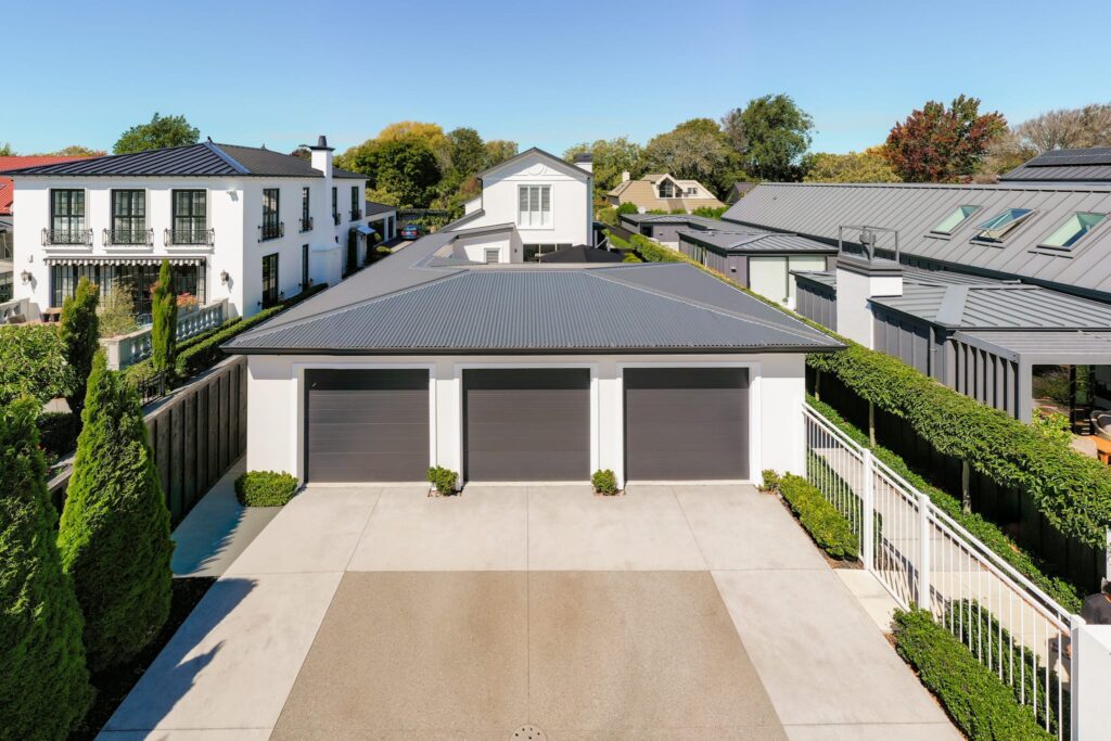 ashby_and_co-exterior_plastering-canterbury-image-mm_shoot-9 Completed exterior plastering and painting on a residential garage featuring clean lines and a refined textured finish, showcasing expert plastering services and durable plaster cladding for modern construction systems.